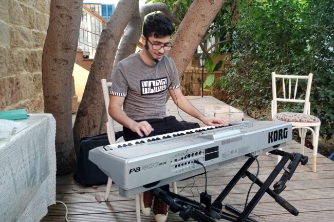 Spreading love through music. Short description: A talented pianist and singer, Anthony Osta plays in an elderly center, putting smiles on the elderly faces and helping them work on their entire psycho-motor skills.