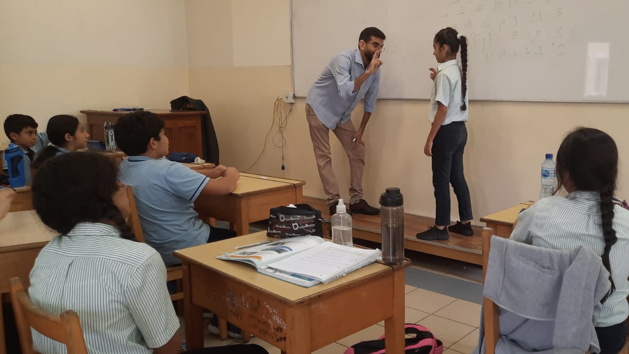Sign Language Teacher: Joe with hearing impairment teaches sign language to the students of Besancon, adding an important language as part of their normal curriculum!
